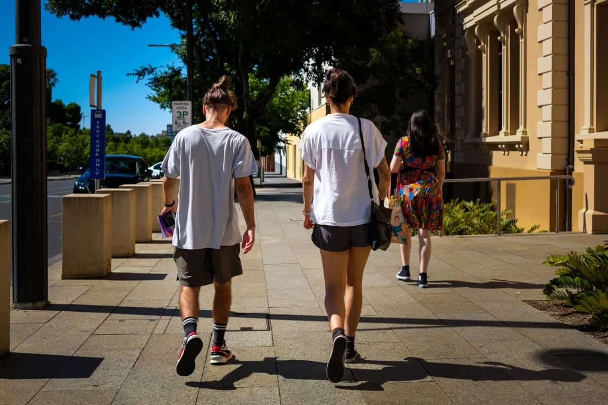 Couple-Walking-on-Sidewalk-Adelaide