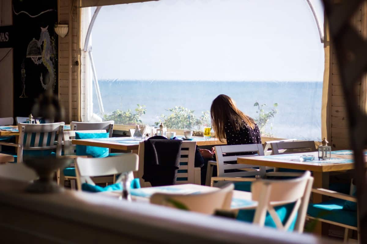 Woman-Sitting-in-Cafe-Brisbane