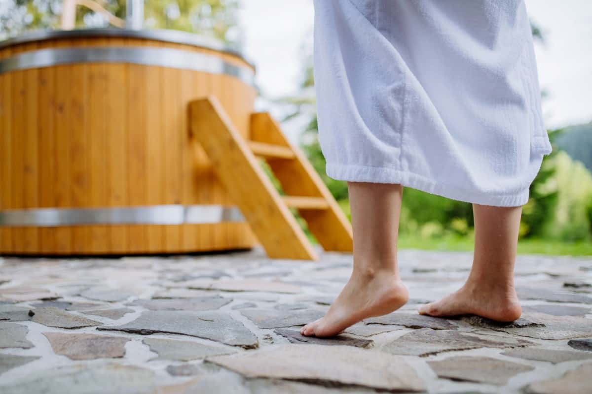 Woman-Standing-Front-of Hot-Tub