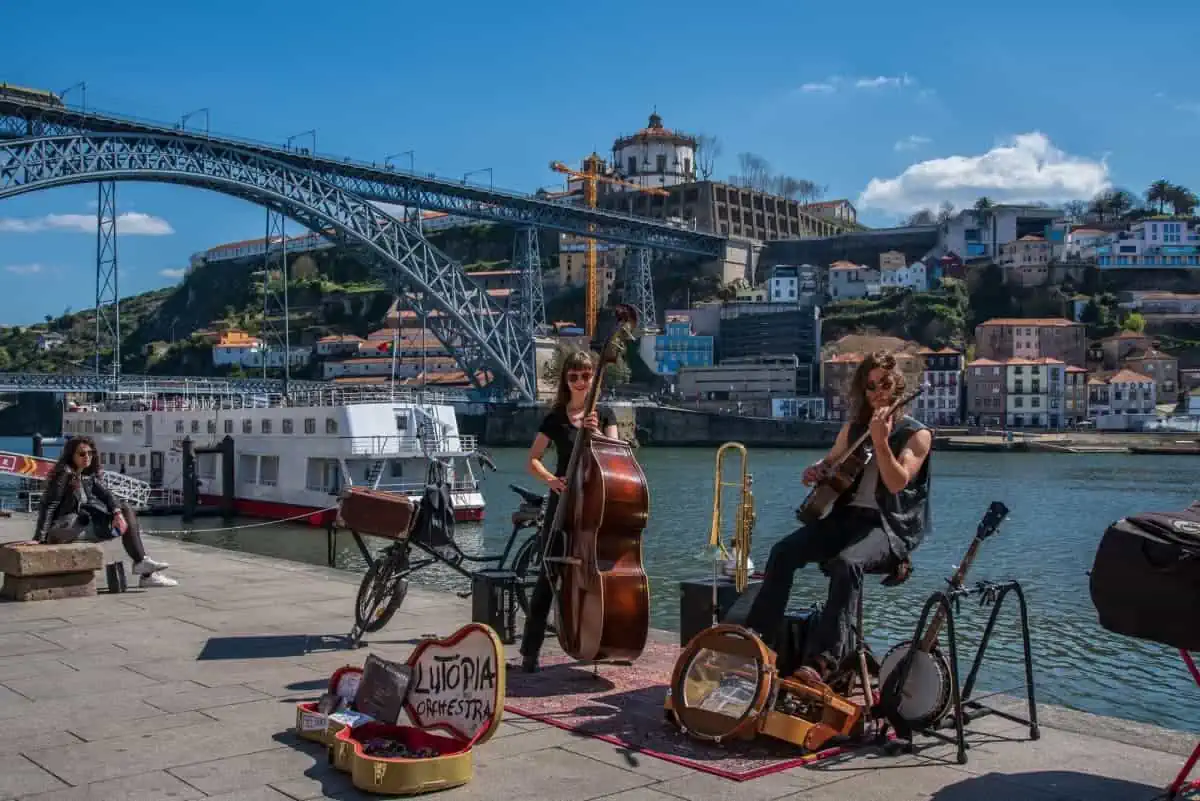 Pros And Cons Of Living In Portugal (2025 Guide) 16 A-Street-Performers-in-Ribeira-Porto