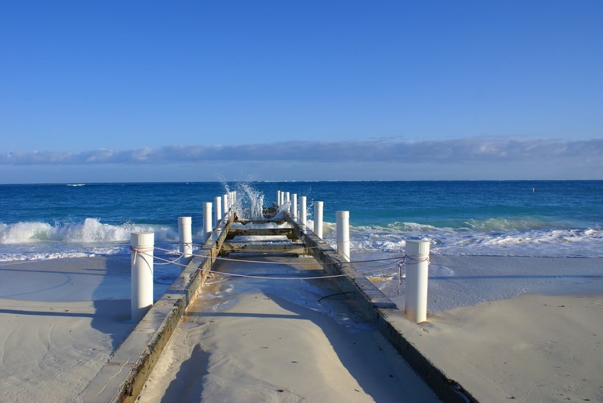Grand Cayman vs Turks And Caicos - An Honest Comparison in 2025 23 A-Wooden-Jetty-at-Caribbean-Sea
