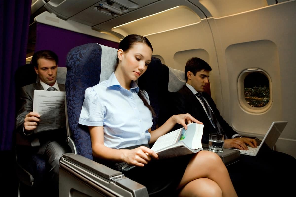 30+ Things To Do on a Plane - On-the-Go Amusements 2 A-Woman-Reading-a-Book-in-a-Flight
