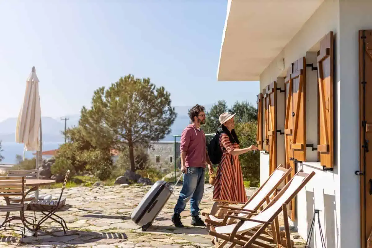 Young-Tourist-Couple-Arriving-Holiday-Home